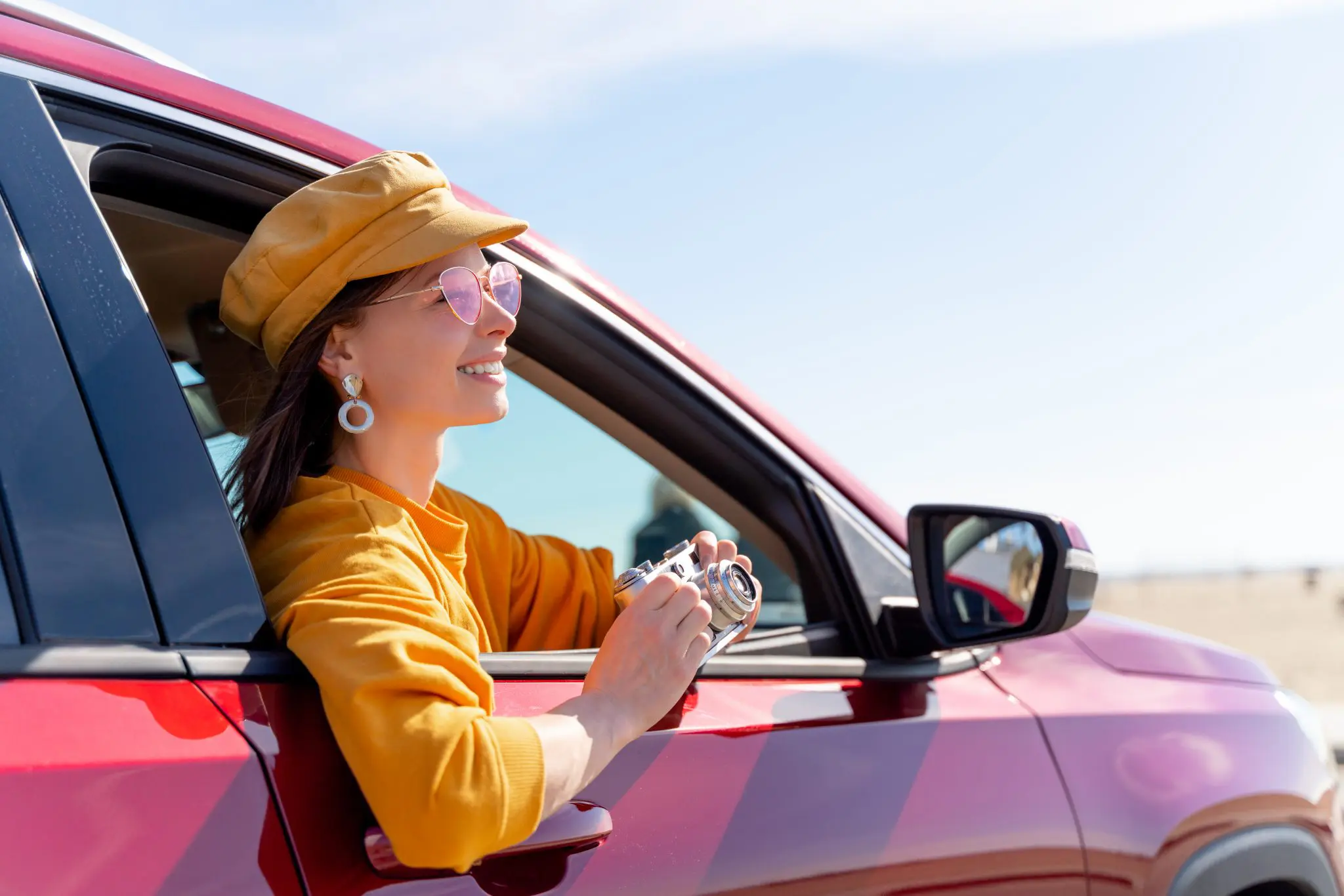 smiling-tourist-in-a-red-car-2021-08-27-10-42-28-utc-2048x1366