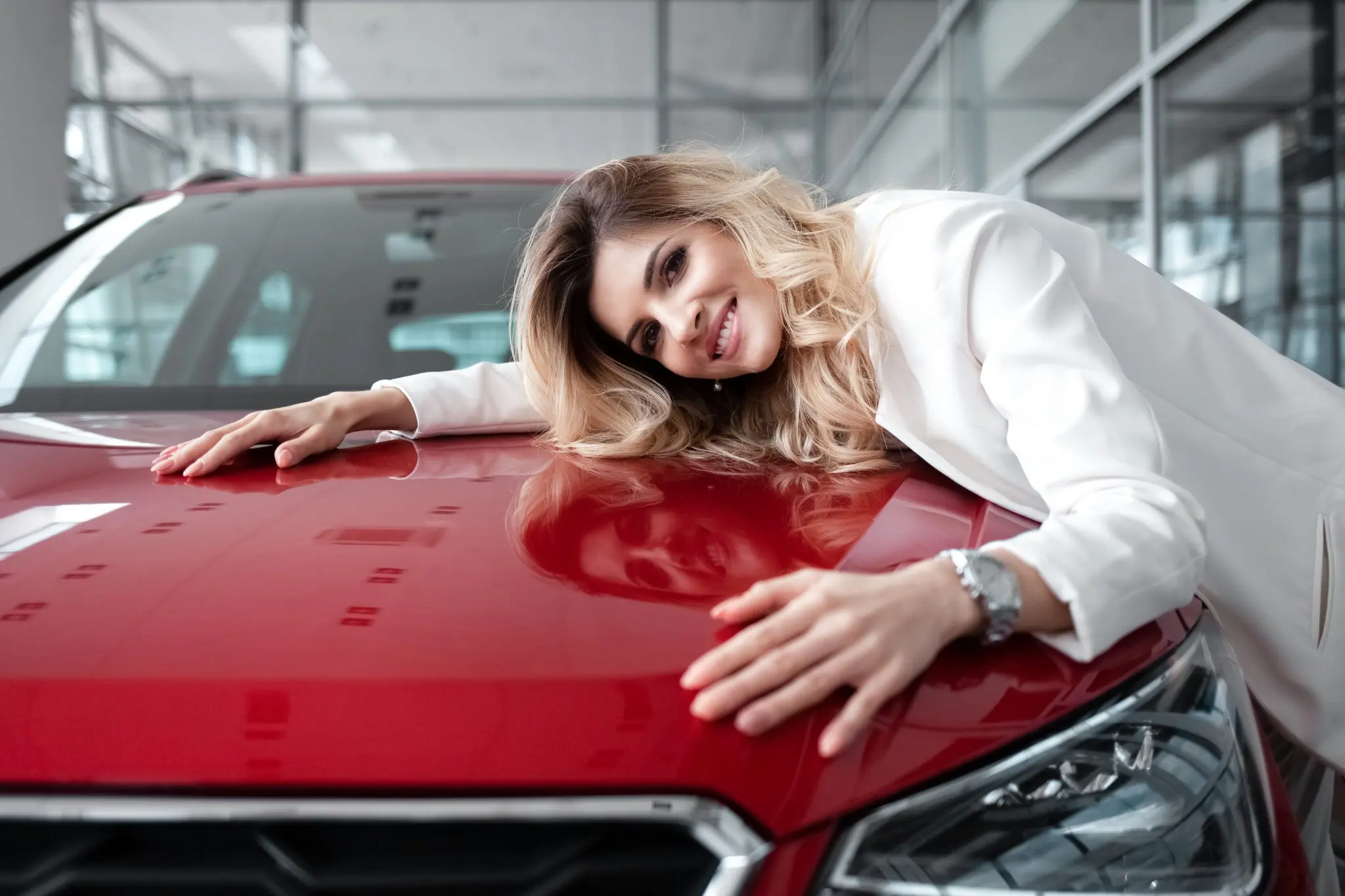 satisfied-girl-happy-to-buy-her-new-red-car-busin-2022-01-20-16-03-04-utc-2048x1365